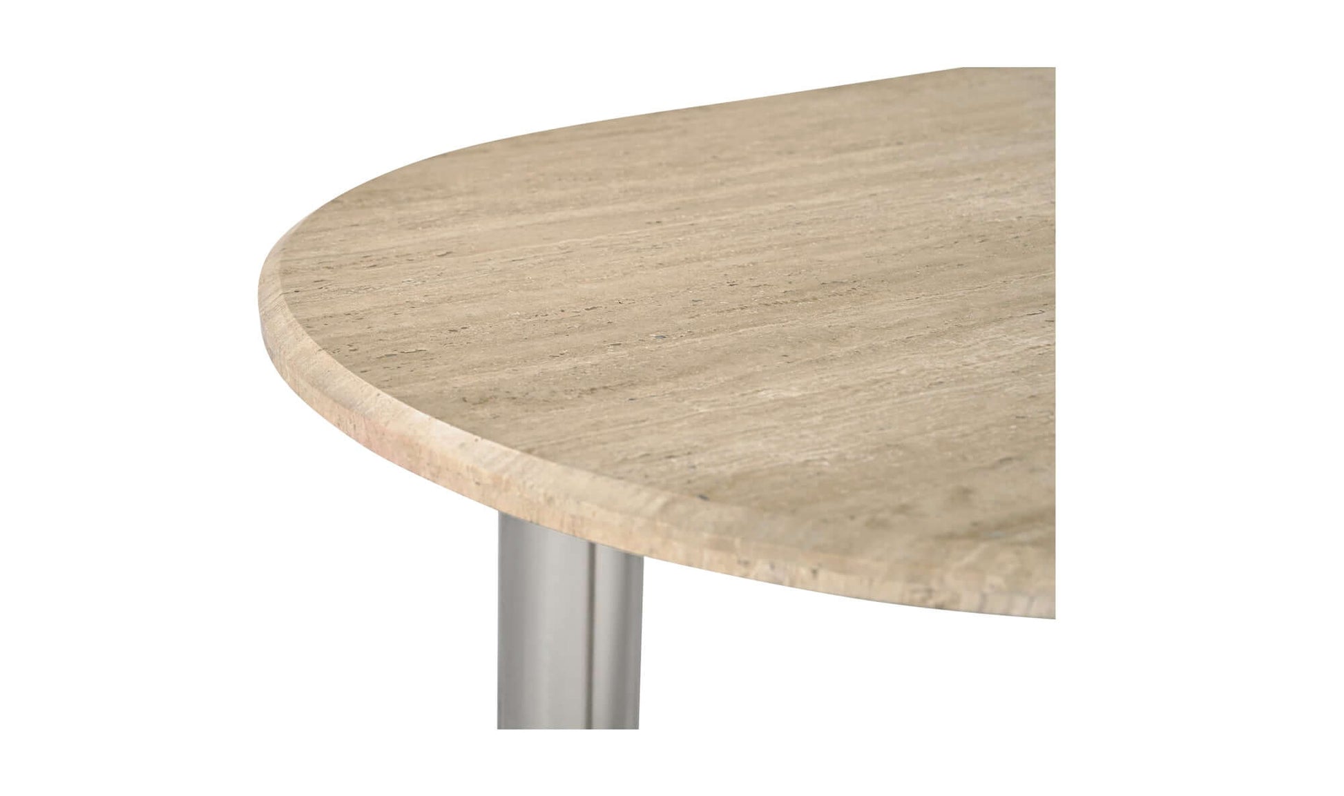 Detailed texture of the beige Italian travertine top of the Fia Dining Table.