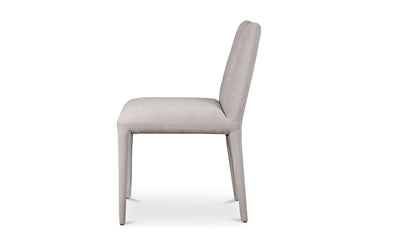 Side profile of Calla Light Grey Dining Chair emphasizing sleek design and robust rubber wood legs.