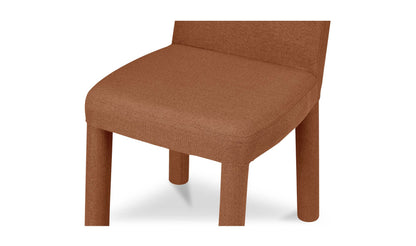 Close-up of the seat cushion of Place Rust Dining Chair by Moe's Home Collection in heavy polyester