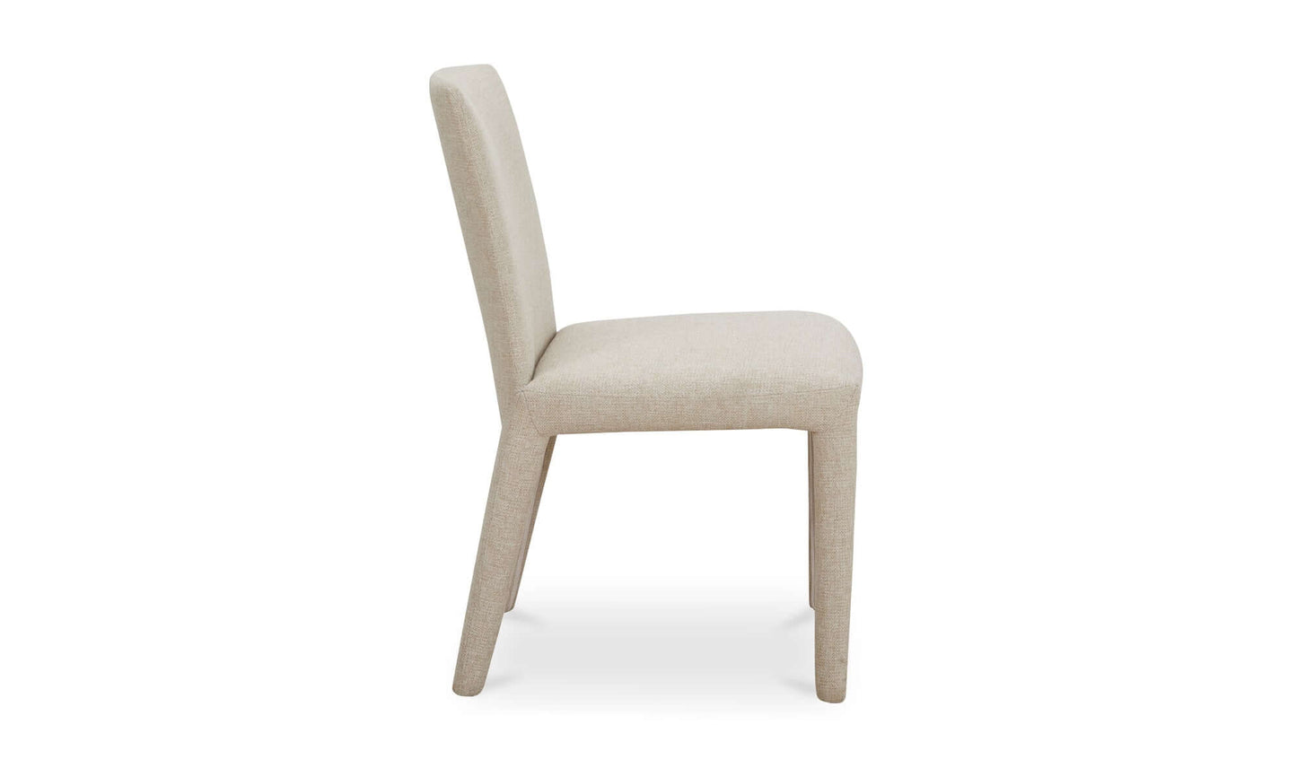 Side view of the Monte Dining Chair Beige showcasing its sleek, fully upholstered design.