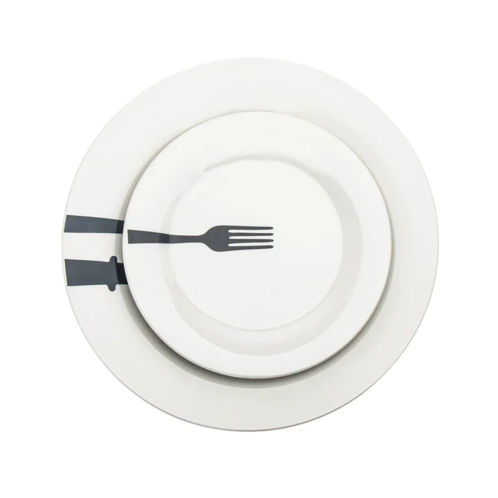 Single white porcelain plate with a fork motif from the Acme Porcelain set, showing off bold black accents.