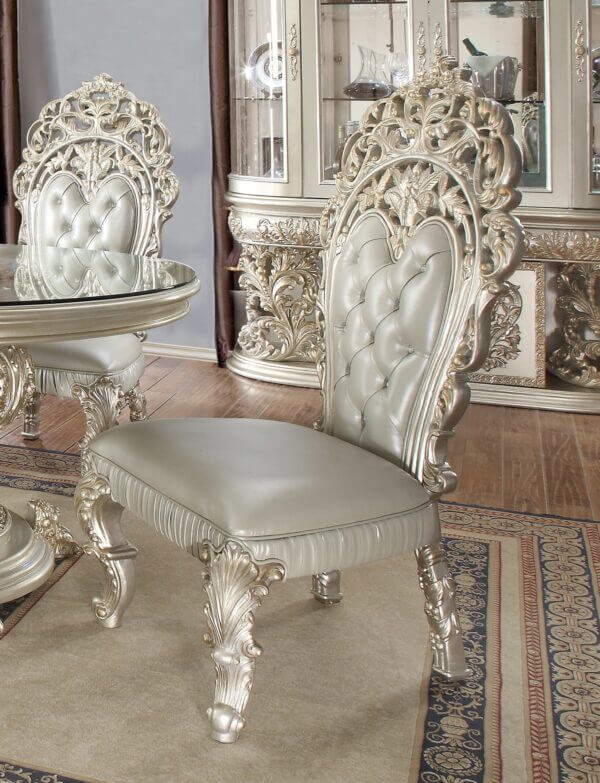 Intricately carved dining chair with silver leather upholstery from the Homey Design HD-8088 dining set