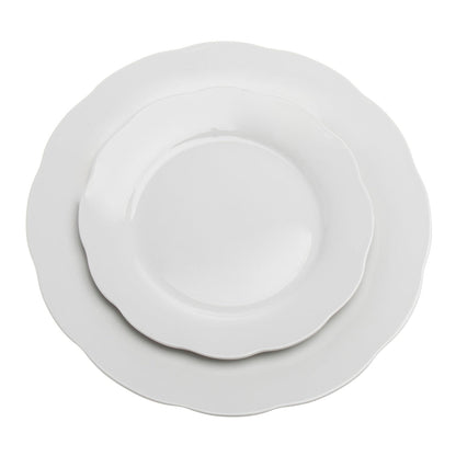 Top view of stracked elegant porcelain dinnerware set with white background