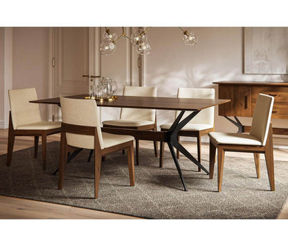 Dining room with Jefferson Dining Table and beige chairs under modern lighting, highlighting its elegant design.