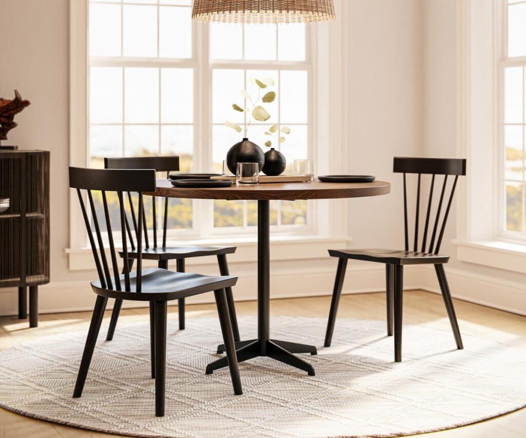 Carter Dining Table with Grey Elm top and Lunar Black metal base, in an elegant dining room setting