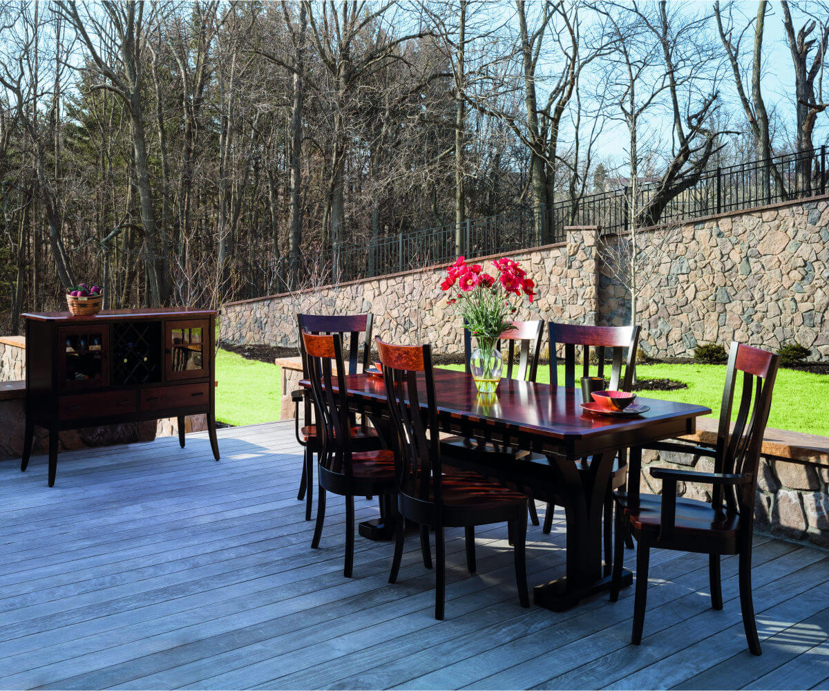 Bristol trestle dining set with Bristol Amish oak dining arm chairs in an outdoor setting