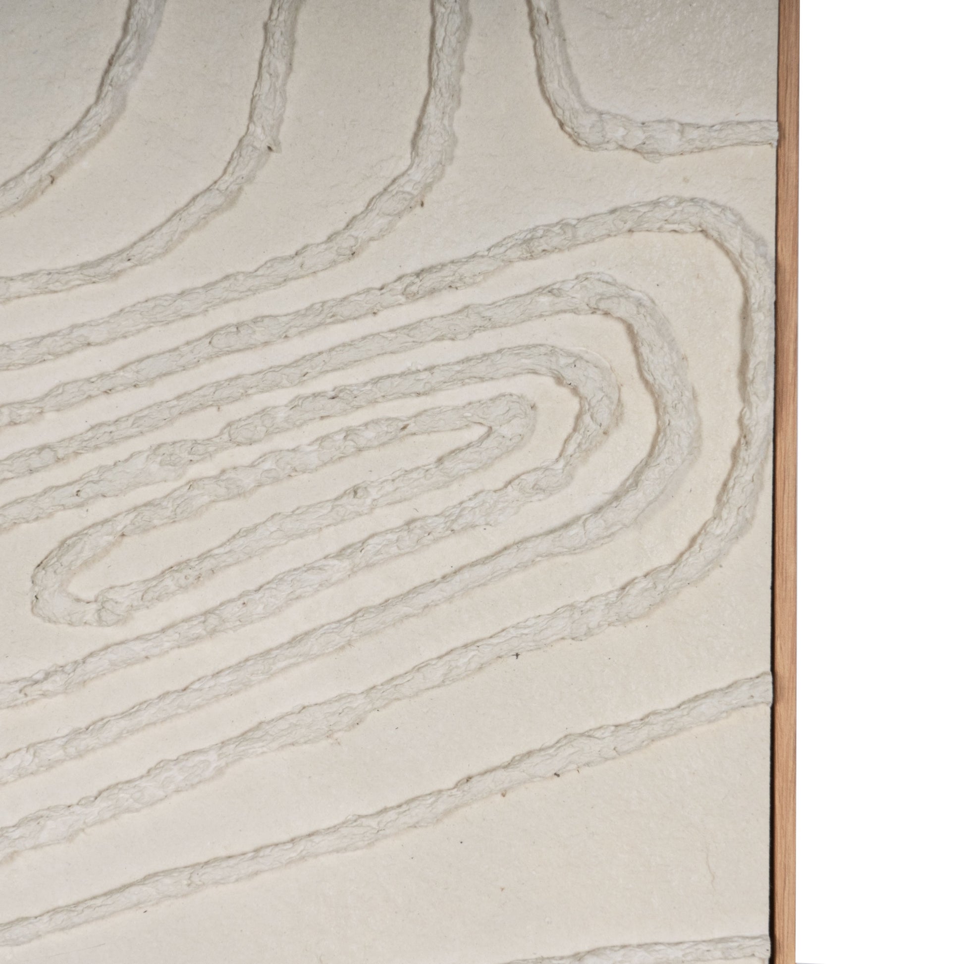 Close-up of abstract beige wall art showcasing textured, concentric patterns.