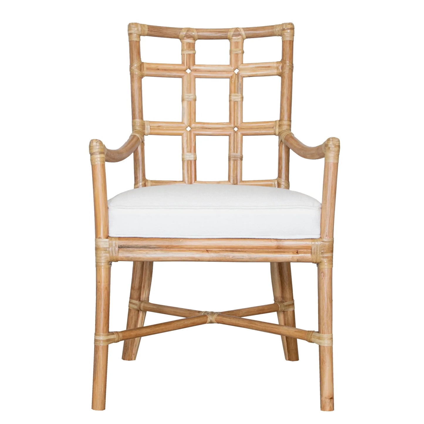 Front view of the Seville Armchair in natural rattan with a white cushioned seat.