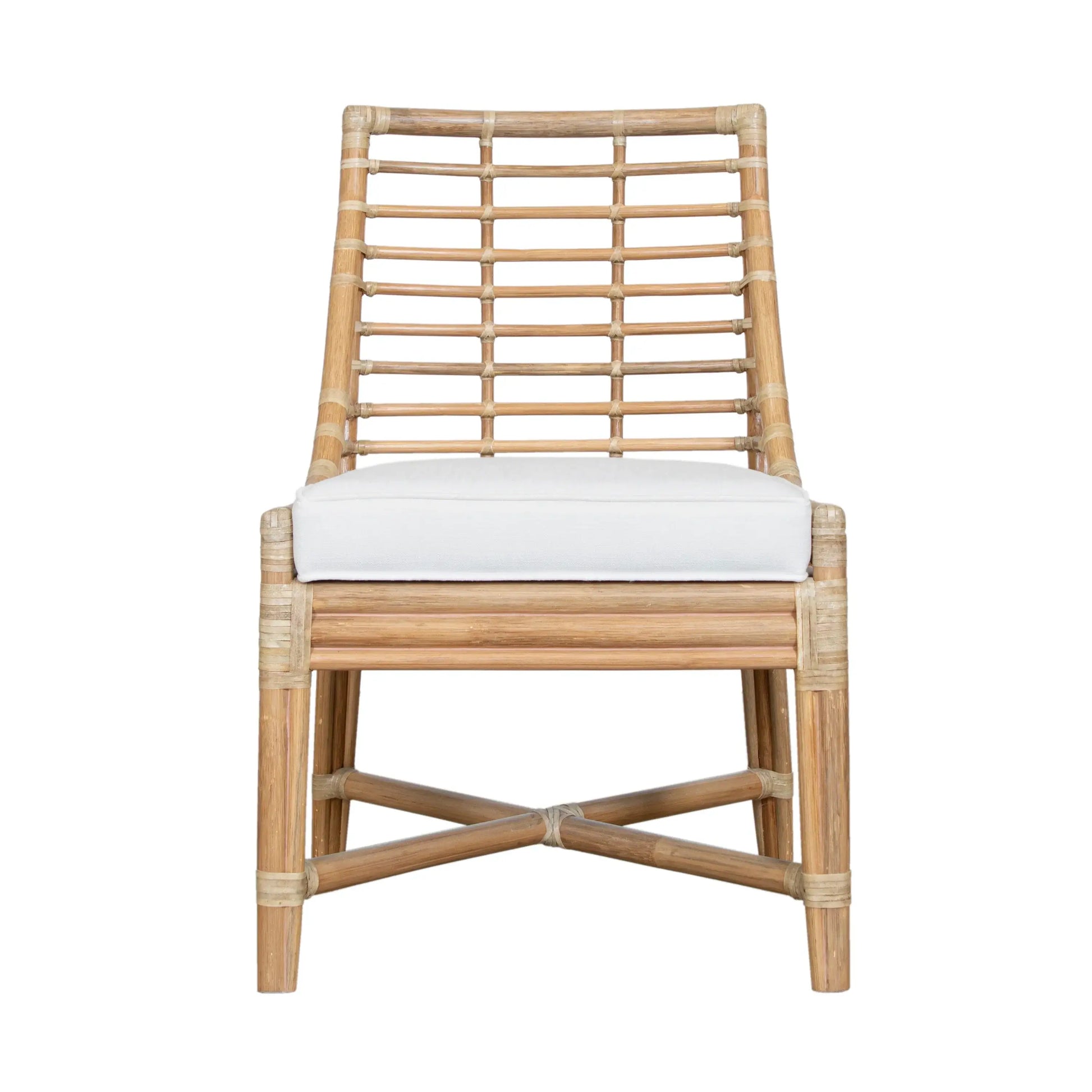 Front view of the Luna Dining Chair displaying its tight boxed seat and rattan frame.