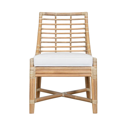 Front view of the Luna Dining Chair displaying its tight boxed seat and rattan frame.