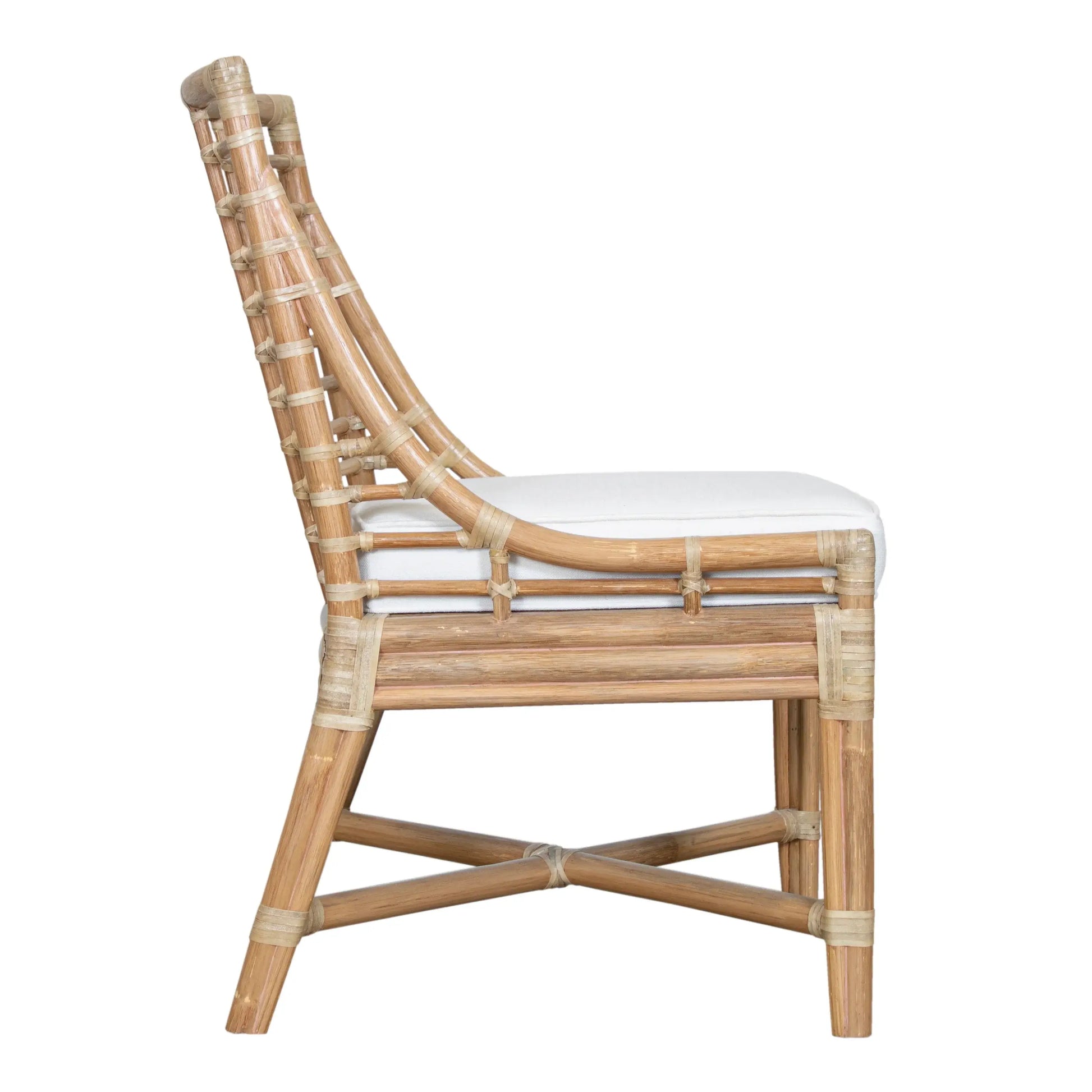 Full side view of the Luna Dining Chair's natural rattan finish.