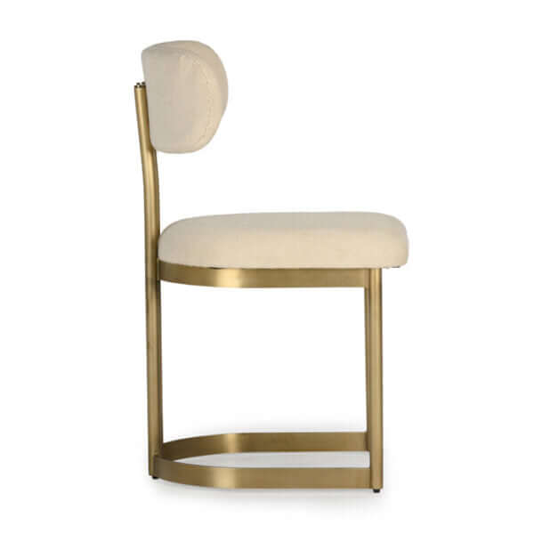 Side view of the Union Home Shay Dining Chair, highlighting the slim profile and luxurious materials.