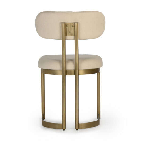 Back view of the Union Home Shay Dining Chair, displaying the elegant brass frame and soft upholstery.