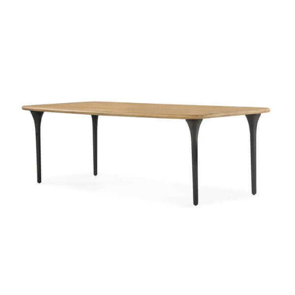 Side view of the Union Home Etro Dining Table, highlighting the smooth transition from wood top to metal legs.