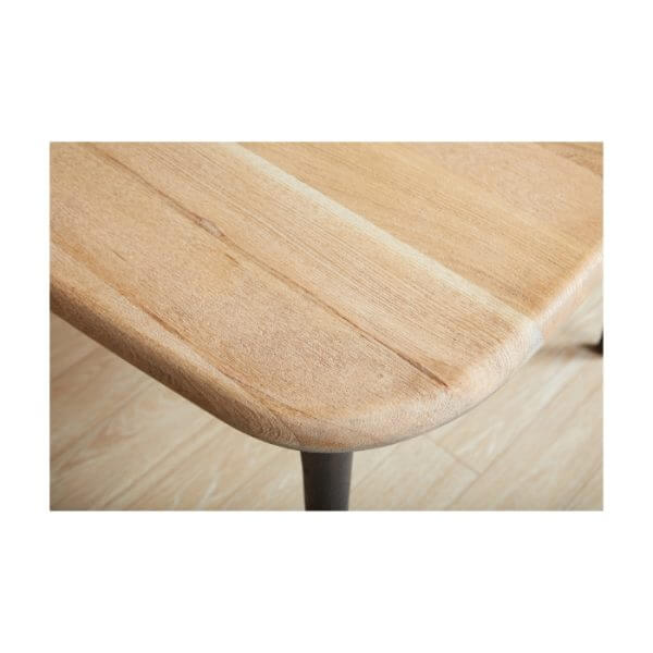 Close-up of the Union Home Etro Dining Table's natural wood surface with detailed grain pattern.