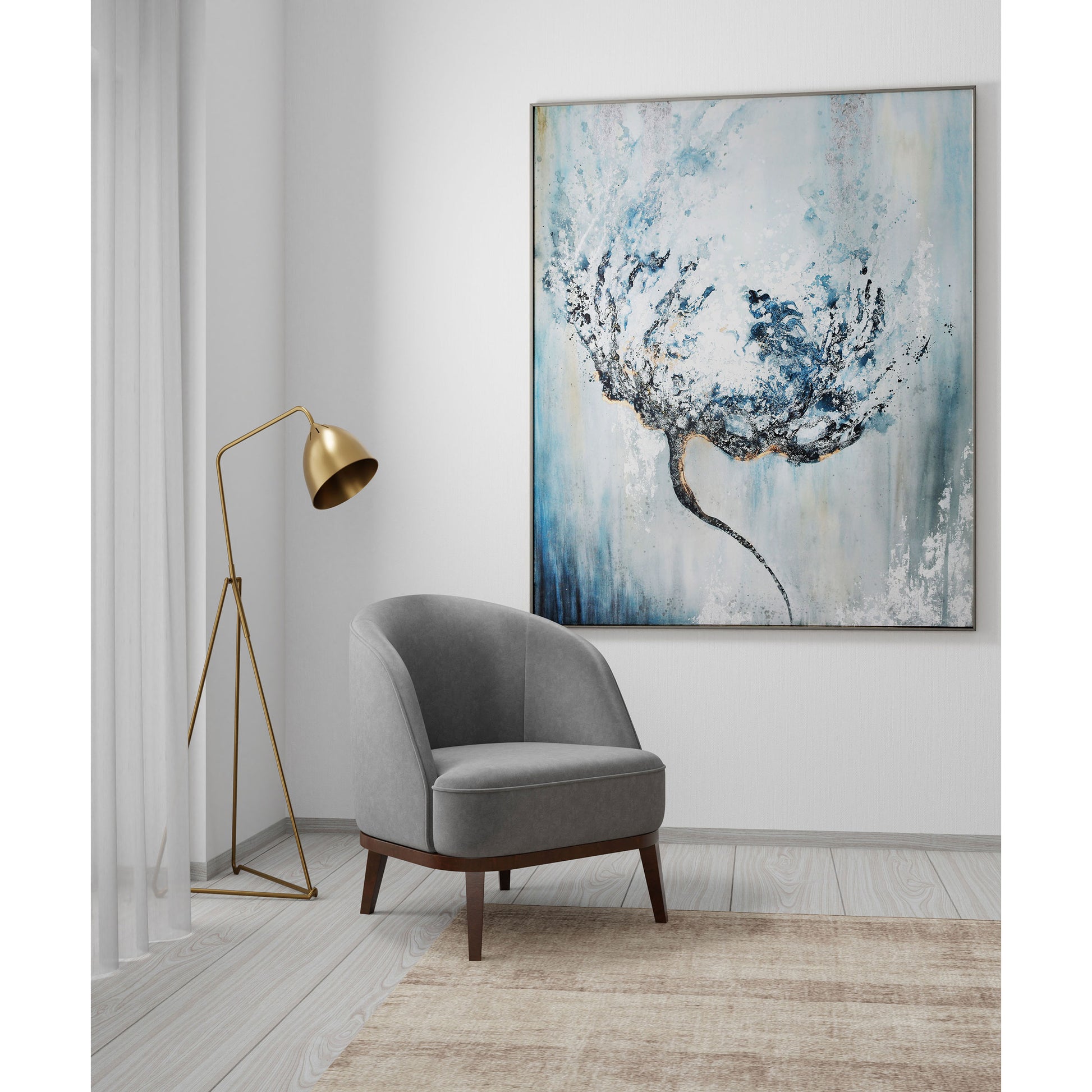 Floral wall art in blue tones, silver frame, gray chair, and gold floor lamp.