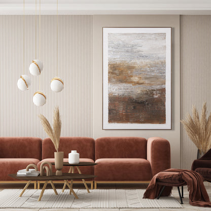 Abstract painting featuring warm earthy tones displayed on a dark accent wall.