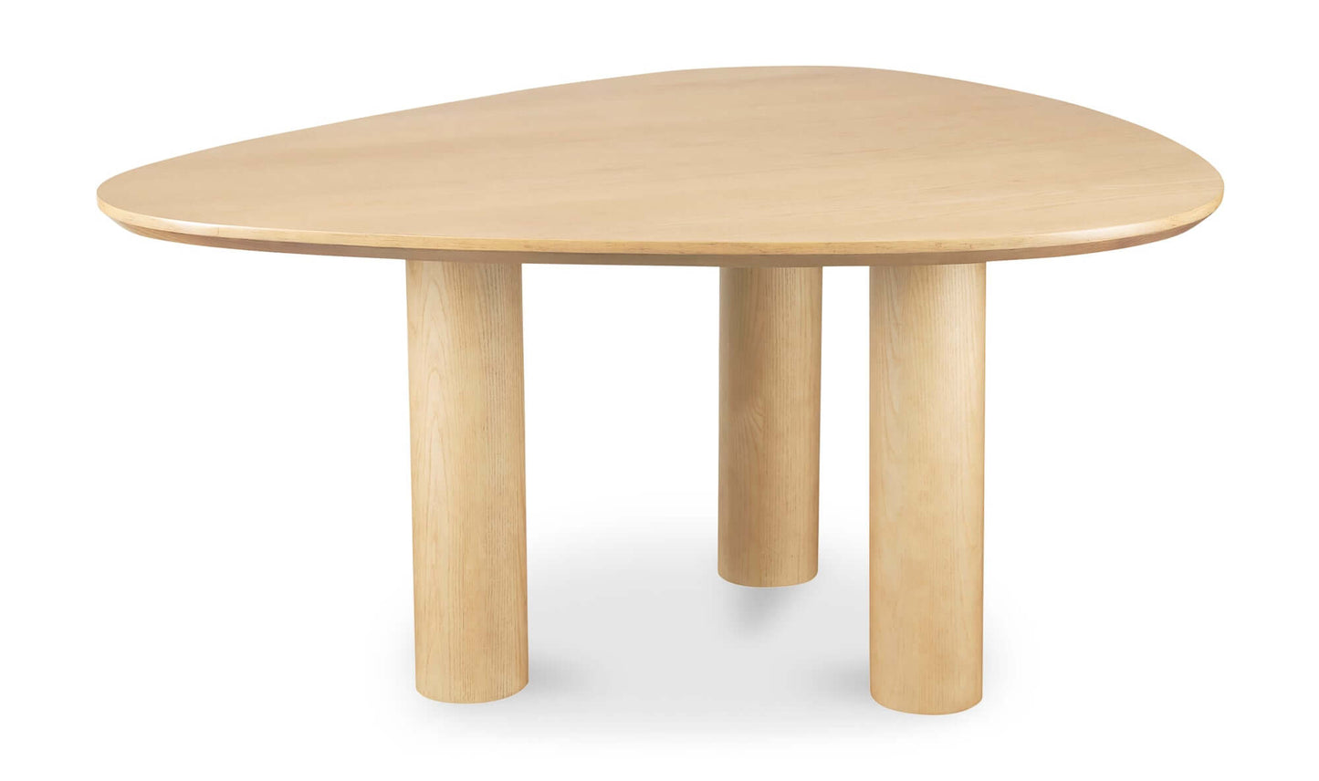 Finley dining table with rounded triangle ash veneer tabletop and three-column base.