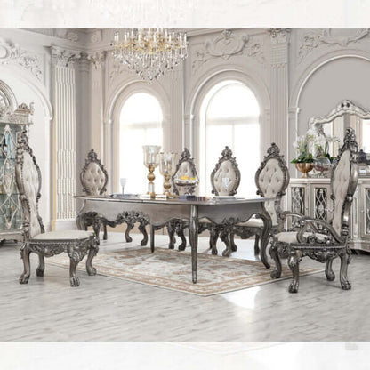 Luxurious Victorian dining set in an elegant room with ornate chairs and a grey table, showcasing intricate details