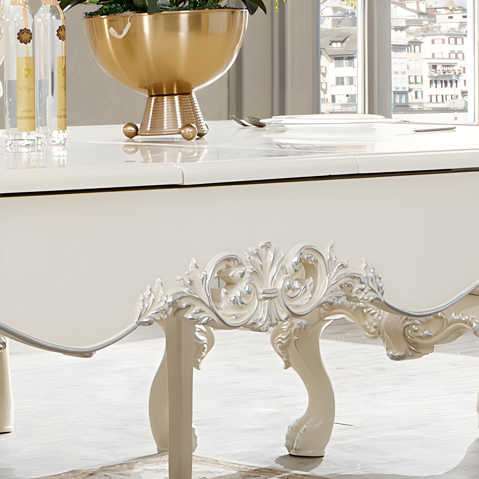 Detailed view of HD-13012-I dining table legs with elaborate carvings and metallic silver highlights.