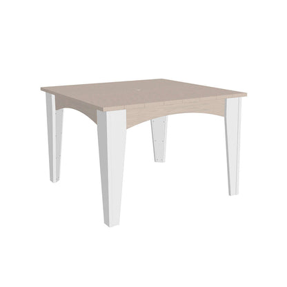 Elegant square outdoor table with a birchwood top and white legs, offering a chic and clean look.