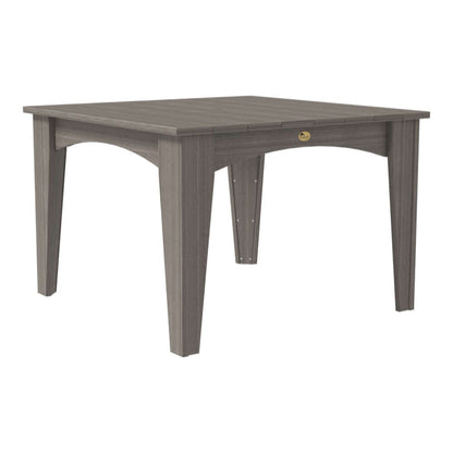 Square dining table featuring a full coastal gray slatted top and legs, blending well with modern outdoor aesthetics.