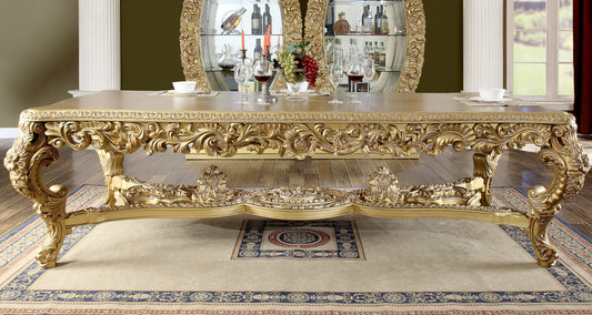 Detailed view of the HD-8012 dining table’s intricately carved apron and gold finish.