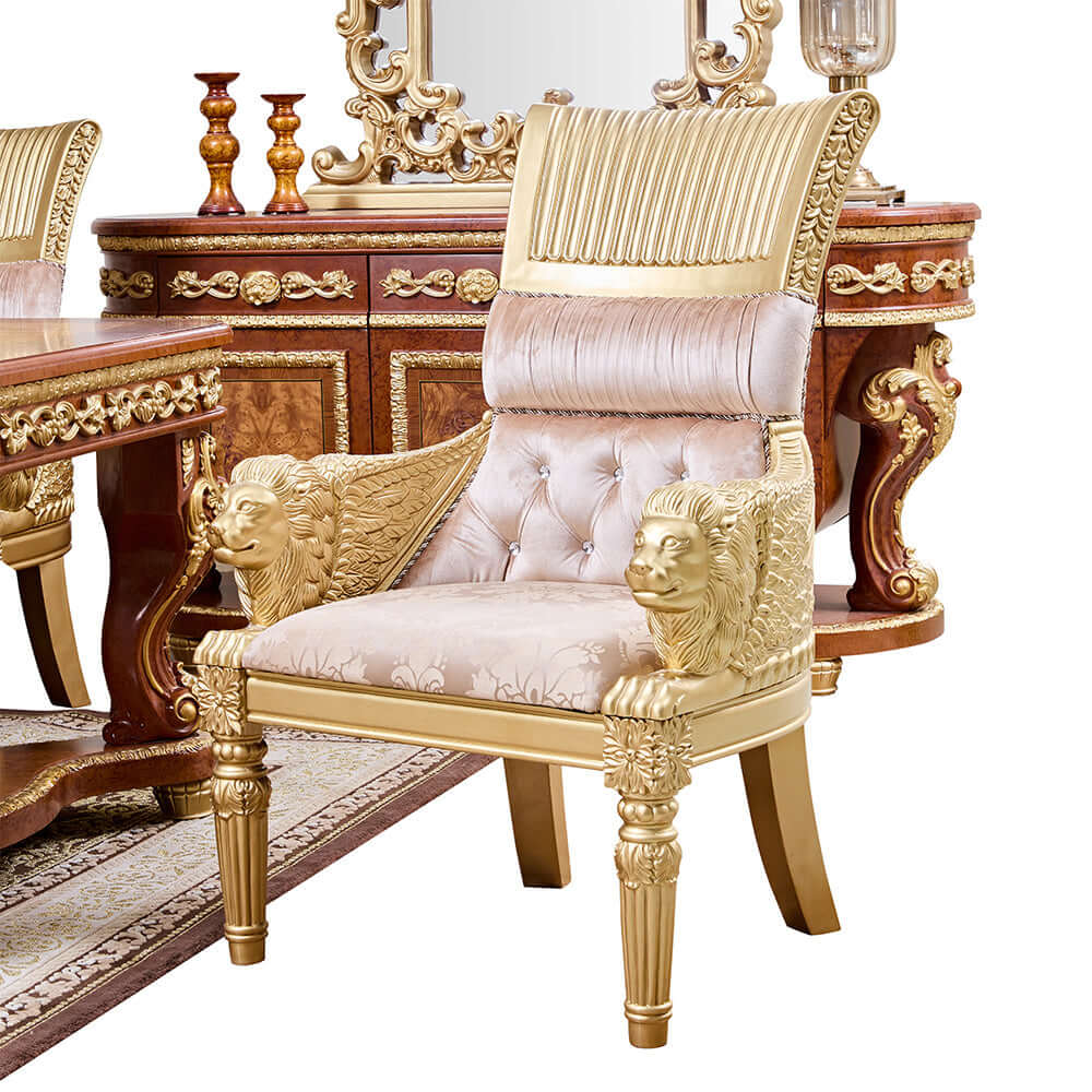 Luxurious beige fabric dining chair with gold metallic frame and lion head details.