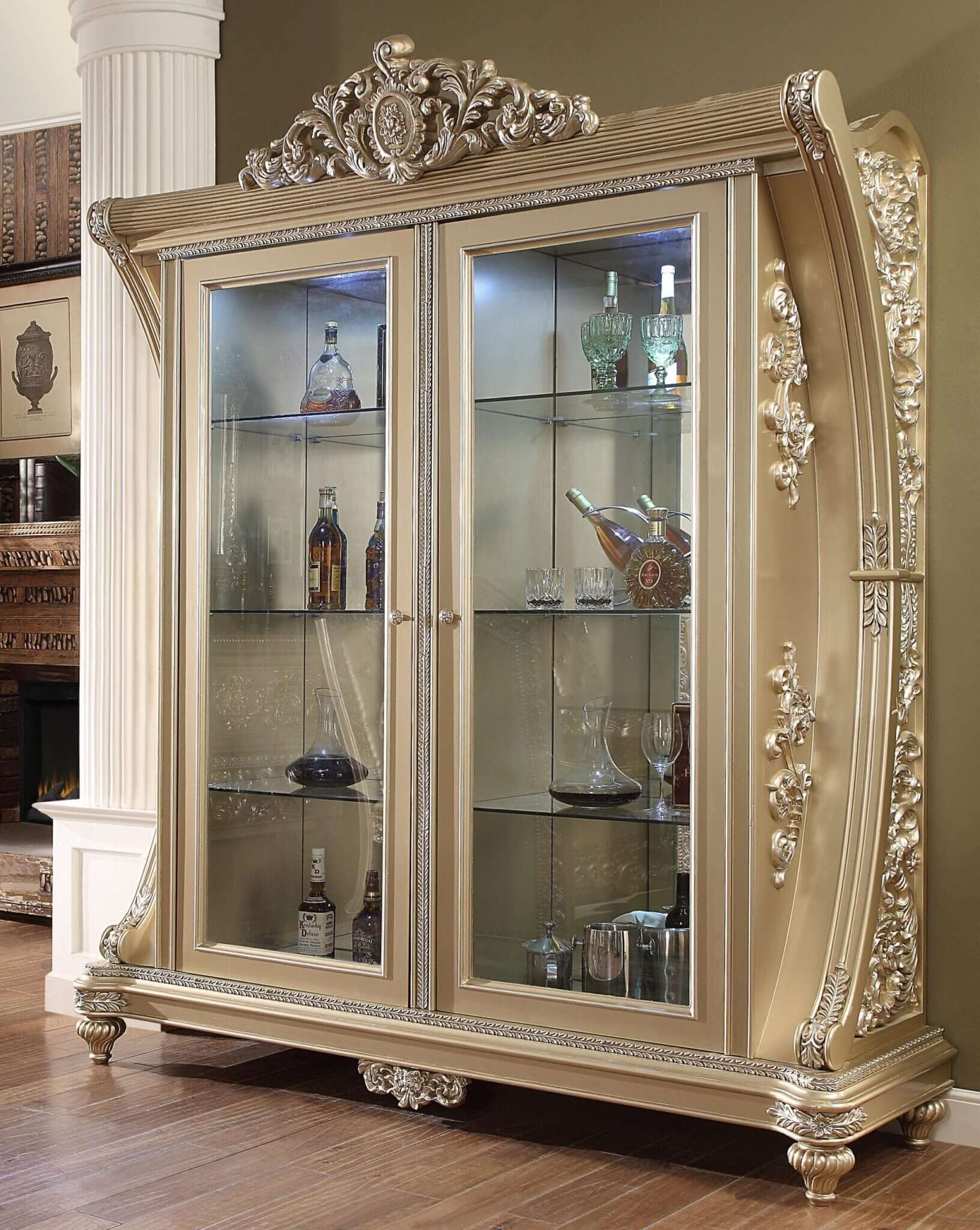 Luxurious silver china cabinet with intricate decorative carvings and crystal-accented glass doors.