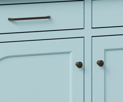 Close-up view of the Houston Hutch & Buffet drawer handles and knobs, featuring a sleek brown design against a light blue painted finish.