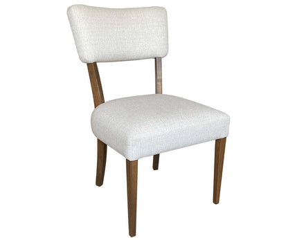 Front view of Kiona Dining Chair with beige upholstery and brown maple wood frame.