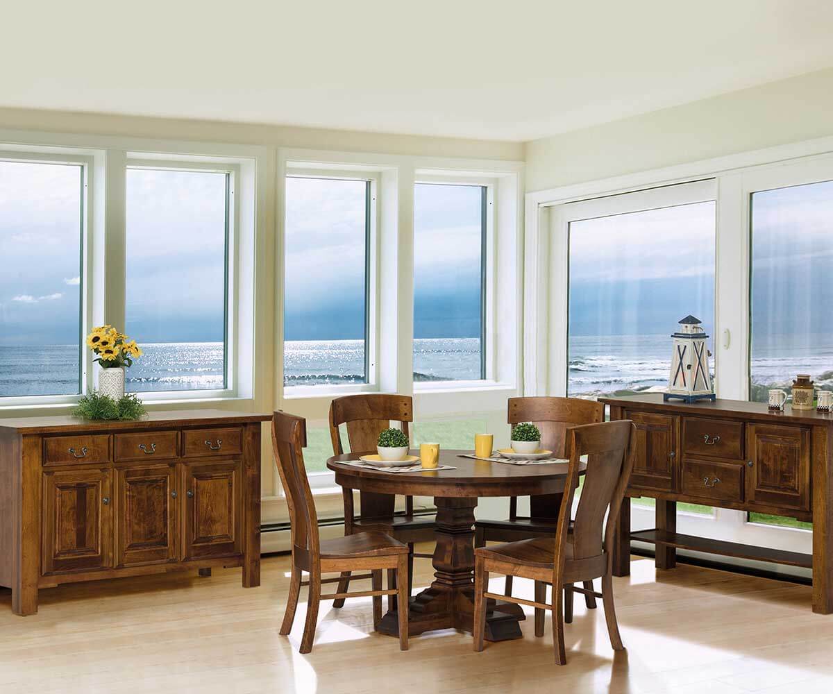 Provincial Cottage Dining Chair set in a coastal dining room with matching wooden furniture.