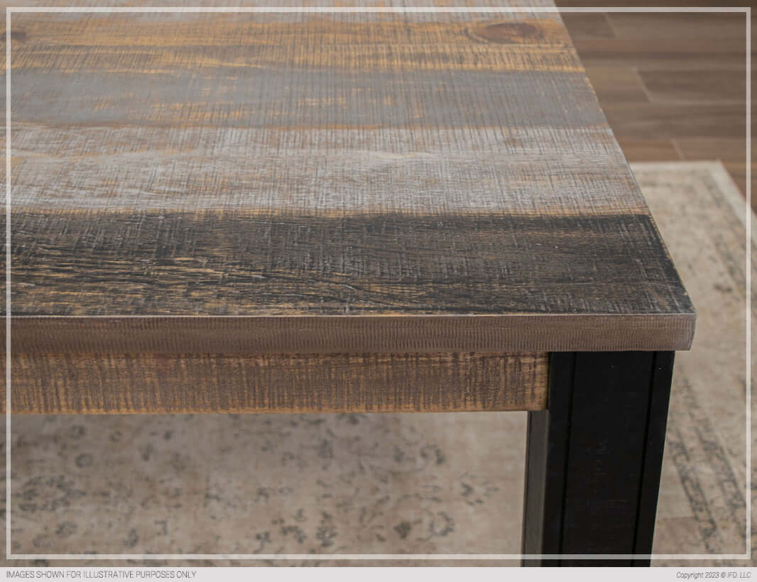 Detailed shot of the grey and brown finish on the Loft Brown dining table's tabletop.