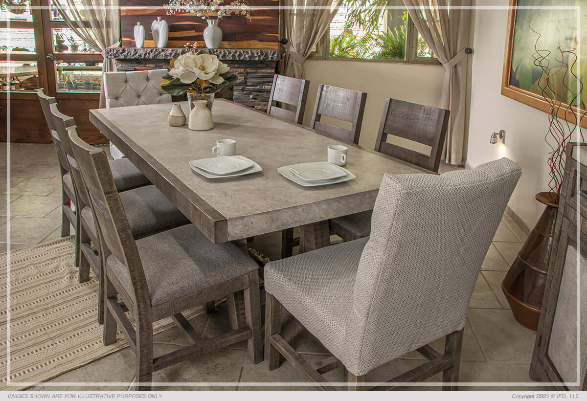 Close-up of dining table with mango wood chairs and faux marble top.