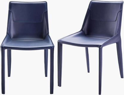 Pair of Surya Hanks Navy Dining Chairs showcasing their modern, minimalist design with blue leather upholstery.