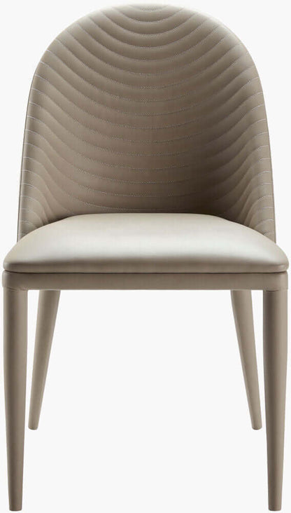 Front view of the Lacey beige leather dining chair by Surya emphasizing the elegant design.