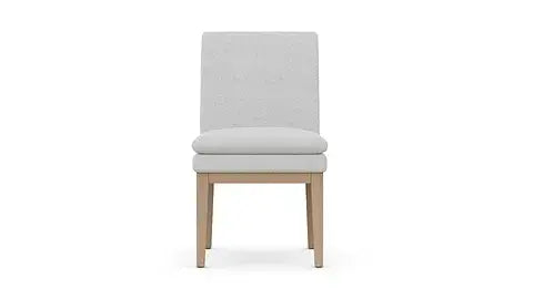 Front view of the Chandler Dining Chair by Case & Canvas in merino pearl fabric.