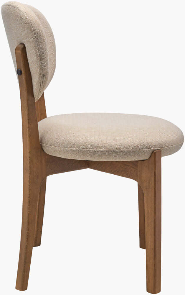 Side profile of Devin Dining Chair highlighting the sturdy beechwood frame and comfortable upholstery.