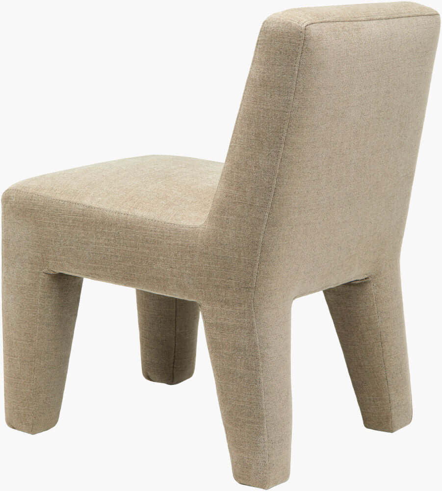 Rear angle of Surya Ginny taupe upholstered dining chair highlighting its seamless upholstery and solid backrest.