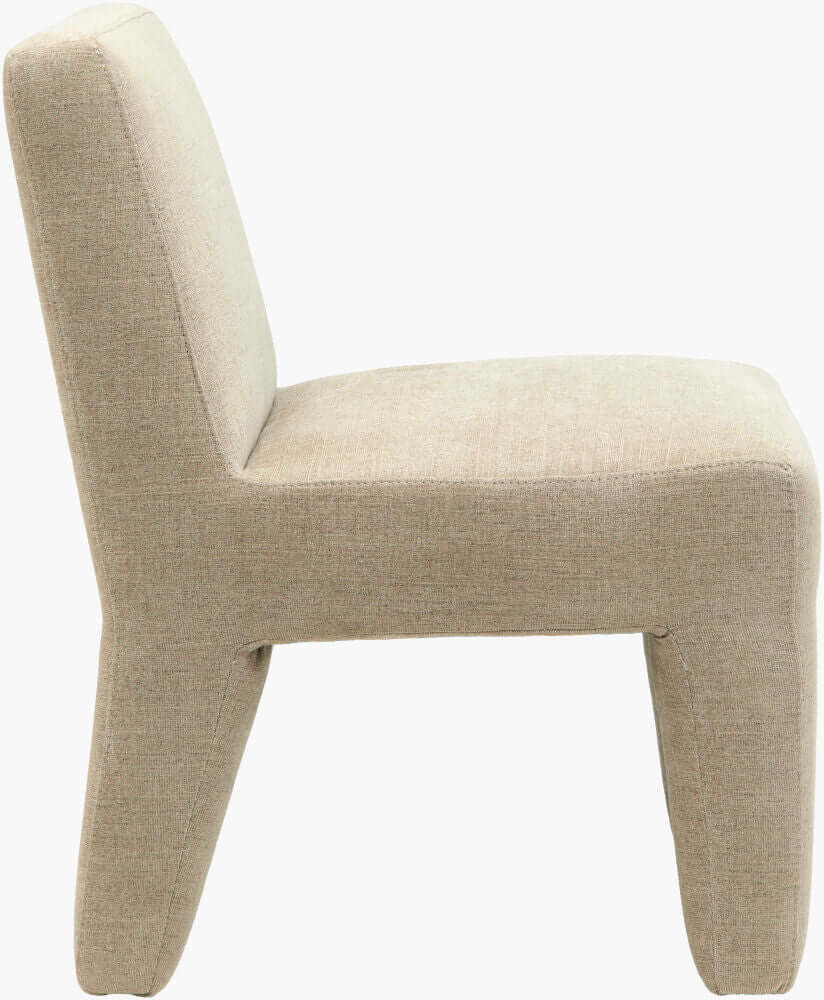 Side profile of the Ginny Dining Chair highlighting its soft taupe fabric and sturdy build.