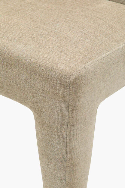 Close-up of the taupe upholstery on the Ginny Dining Chair by Surya.