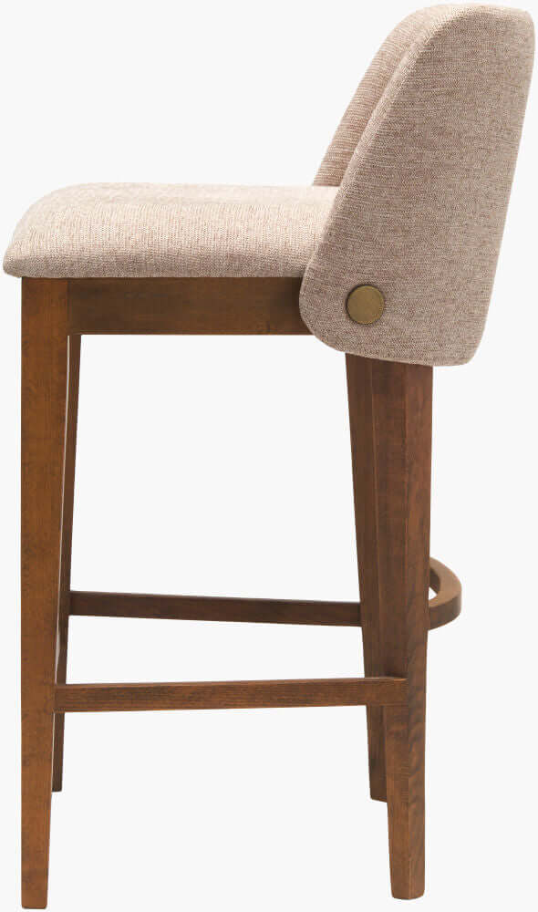 Side view of the Brooke Counter Stool highlighting the sturdy wooden frame and the upholstered backrest.