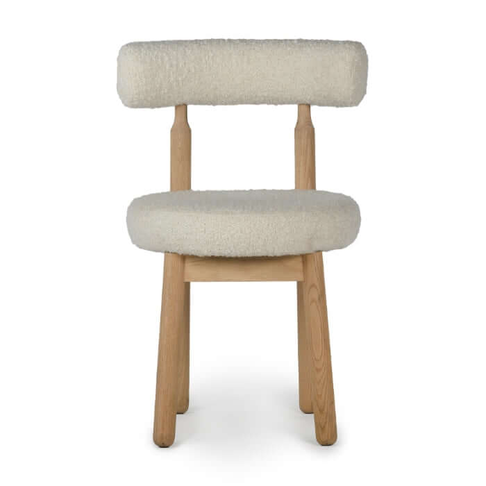 Front view of the Centro Dining Chair Natural by Union Home, showcasing its sleek design and plush boucle seat.