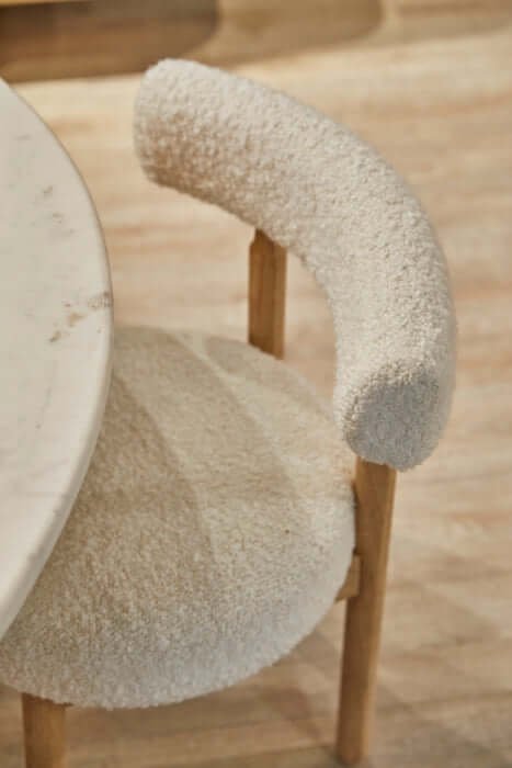 Centro Dining Chair Natural by Union Home, detailed view of the oak legs and boucle fabric, emphasizing craftsmanship