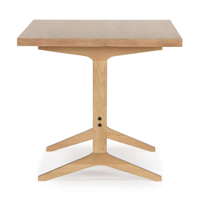 End view of the Denver Dining Table Natural, featuring its sturdy construction and softened edges.