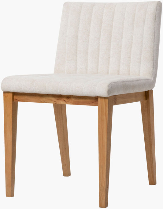 Side view of the Surya Joanne Dining Chair with natural wooden legs and neutral polyester upholstery.