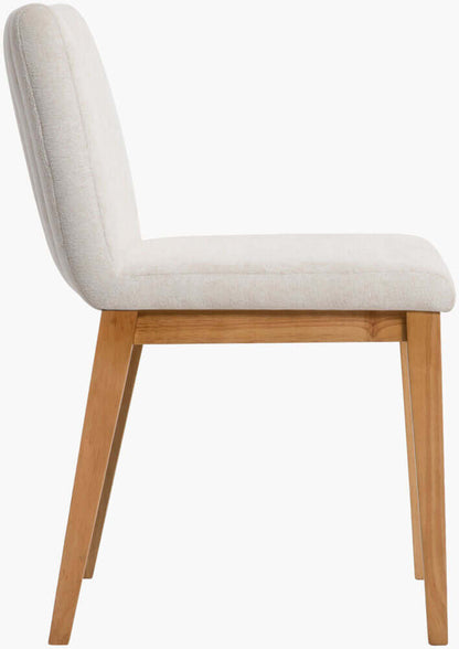 Side view of the Surya Joanne Dining Chair with natural wooden legs and neutral polyester upholstery.