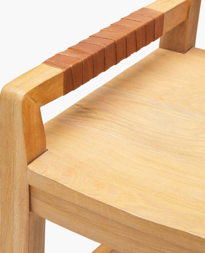 Close-up of the seat and legs of the Uintah Counter Stool by Surya, showing the natural grain of the oak.