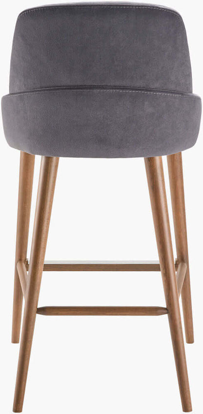 Rear view of a modern counter stool with a dark gray upholstered backrest and wooden legs, showcasing its sleek and minimalist design.