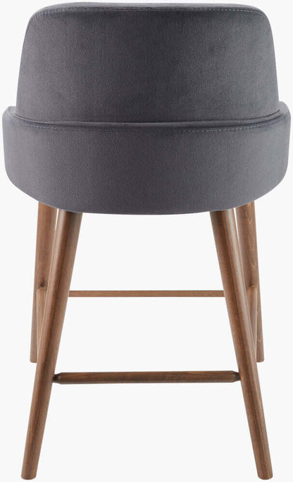 Rear view of the Peregrine Counter Stool highlighting the sturdy beech wood legs and black upholstery.